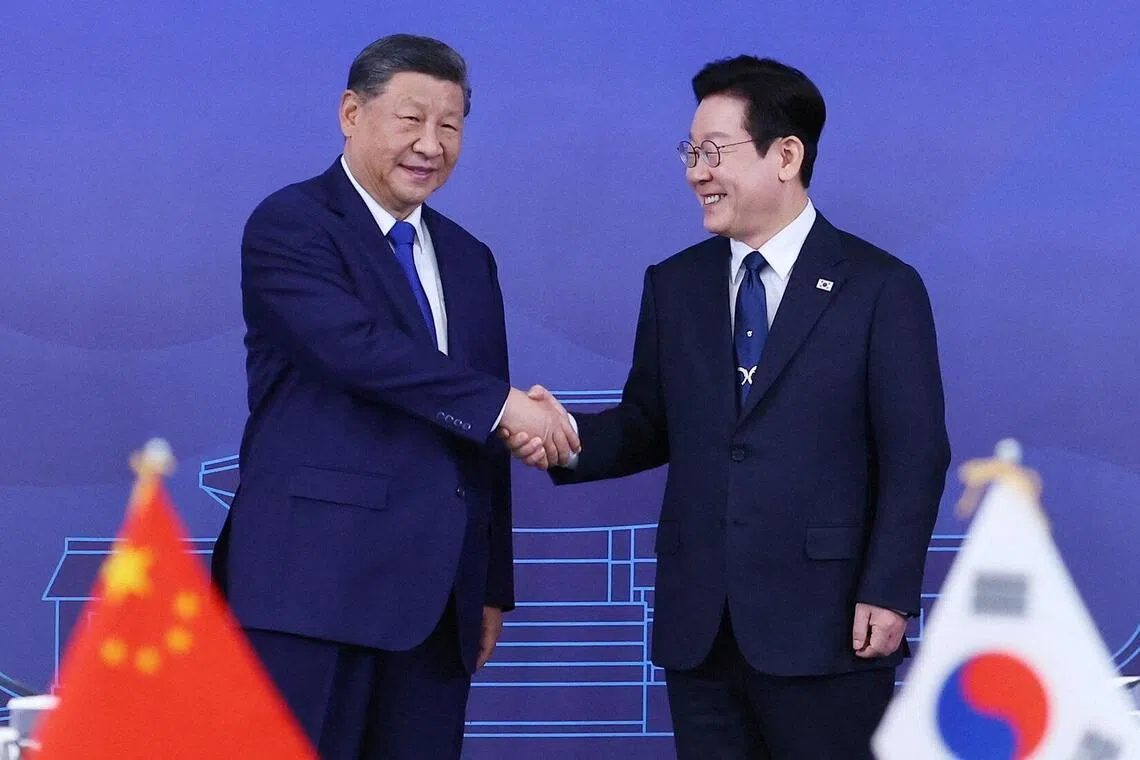 China's President Xi Jinping shakes hands with South Korea's President Lee Jae Myung in Gyeongju, South Korea, Nov 1, 2025. The upcoming visit marks the second meeting between the pair in just two months.