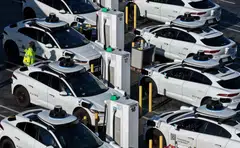 Waymo robotaxis sit parked at a Waymo facility in San Francisco, California, Dec 08, 2025.