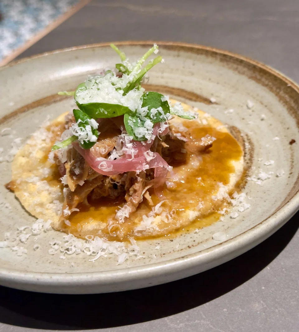 Braised rabbit on a cassava flatbread.