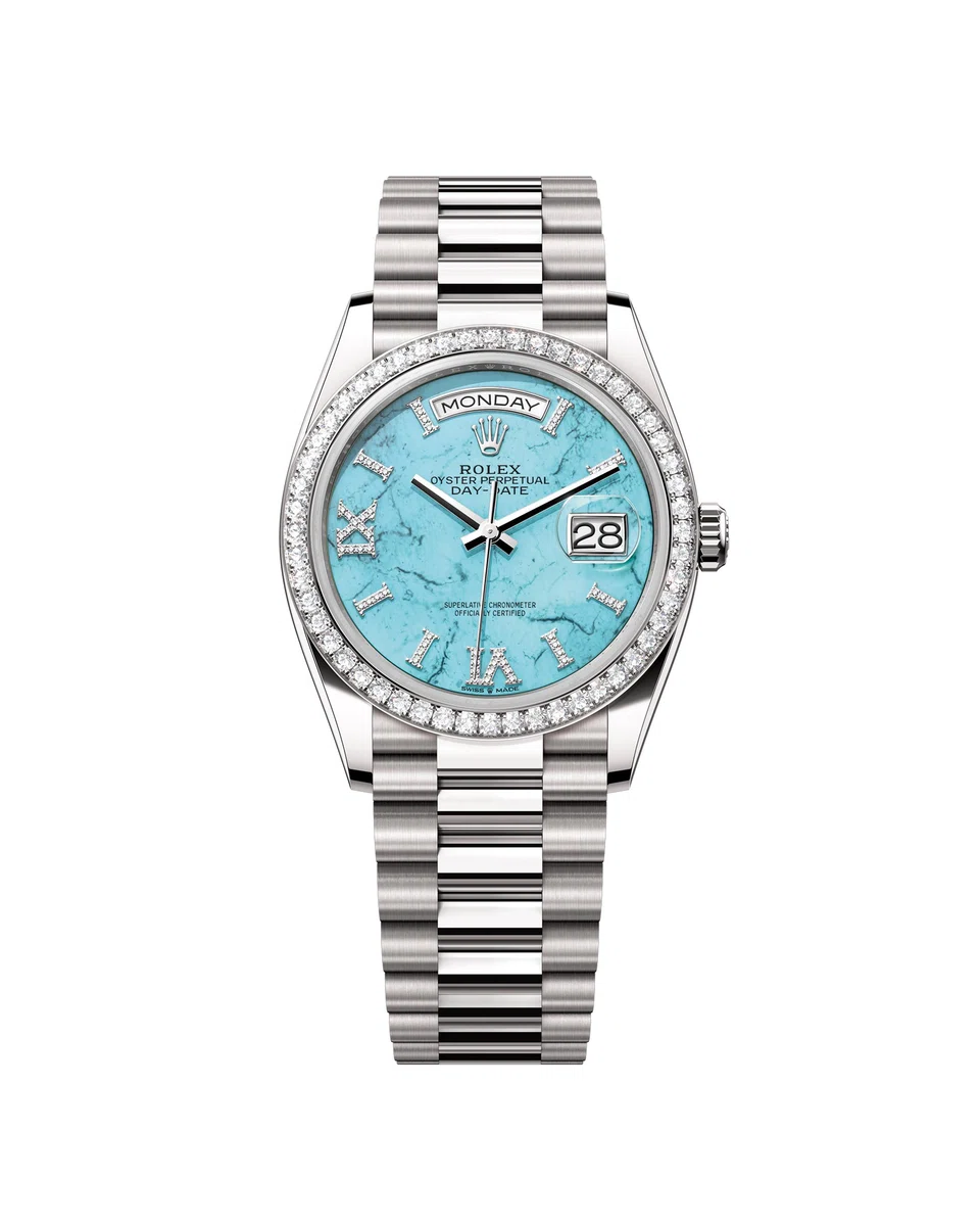 The Oyster Perpetual Day-Date 36 in 18-karat white gold with a turquoise, diamond-set dial, fluted bezel and President bracelet.