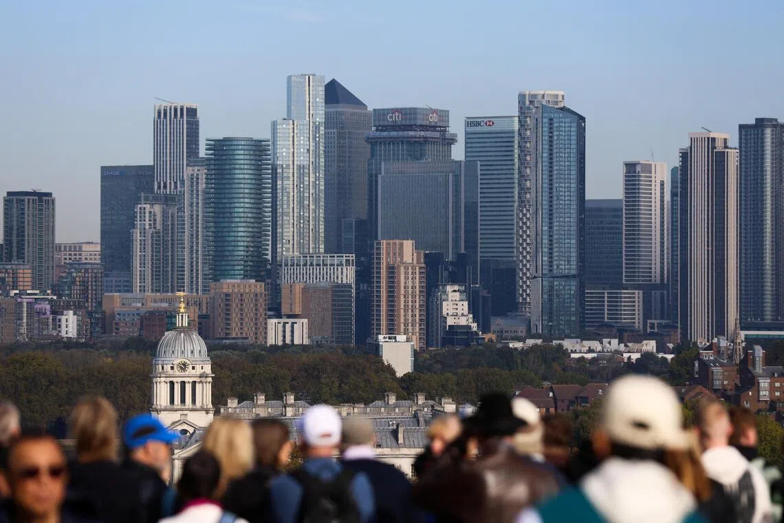The new JPMorgan building will be in Canary Wharf (above), and will contribute £9.9 billion over six years to the local economy.
