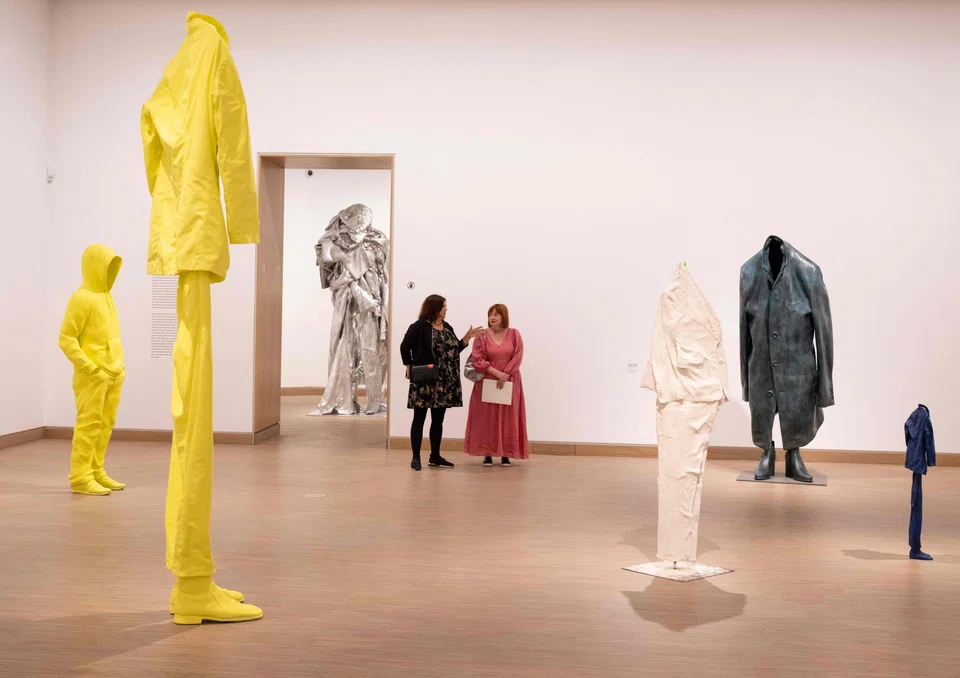 There is a darker undercurrent to some of Wurm's most recent creations, such as a sculpture of what seems like someone wearing a shirt and pants but with no head.