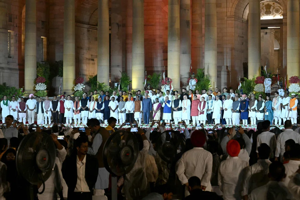 The 71 members of his government took the oath of office after Modi on Sunday, with 11 posts going to coalition allies who extracted them in exchange for their support – including five in the top 30 cabinet posts.