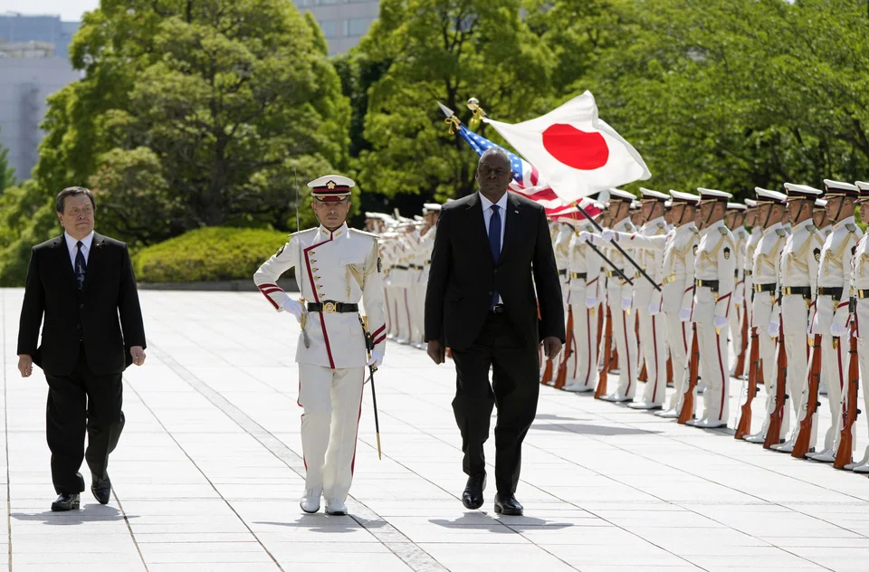 US Secretary of Defence Lloyd Austin (right) and Japanese Defence Minister Yasukazu Hamada (left) review the guard of honour at the Defence Ministry in Tokyo, Japan, June 1, 2023. 