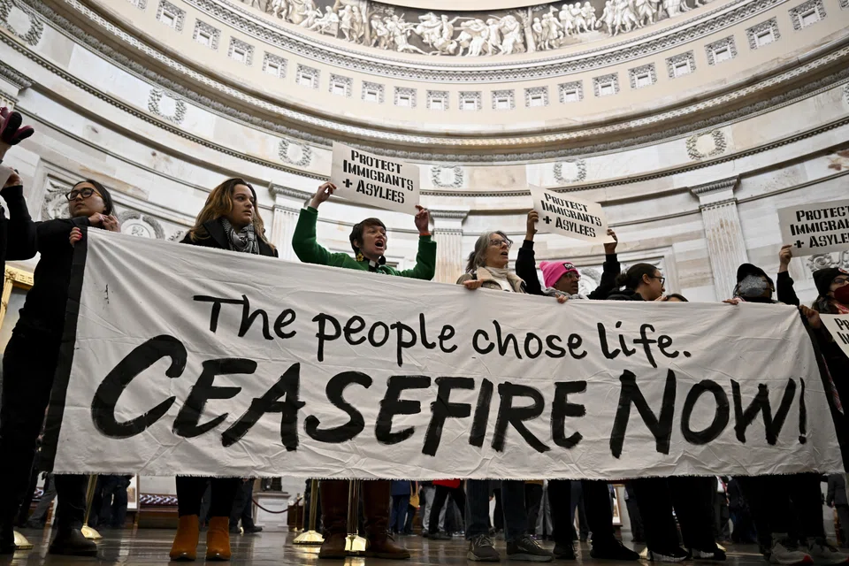 Anti-war activists protesting in the Capitol Building in Washington on Dec 19. Some Democratic lawmakers have been calling for a ceasefire in Gaza, but the idea has been rejected by Israel.