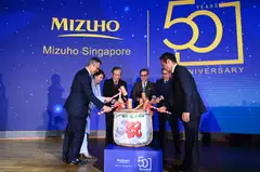 (From left) Mizuho Bank co-CEO for Asia Pacific Yasuhiro Kubota, Mizuho Bank Singapore CEO Josephine Lok, Deputy Prime Minister Gan Kim Yong, Mizuho Financial Group chairman Seiji Imai, Japanese Ambassador to Singapore Hiroshi Ishikawa and Mizuho Bank CEO for Asia-Pacific Koichi Zaiki at a sake-breaking ceremony.