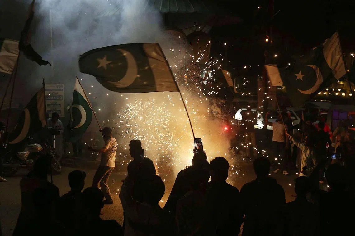 Pakistanis celebrate after the ceasefire between Pakistan and India on May 10. Five days after the conflict, the S&P 500 rose 0.2 per cent, and rose 5.7 per cent 30 days after. 