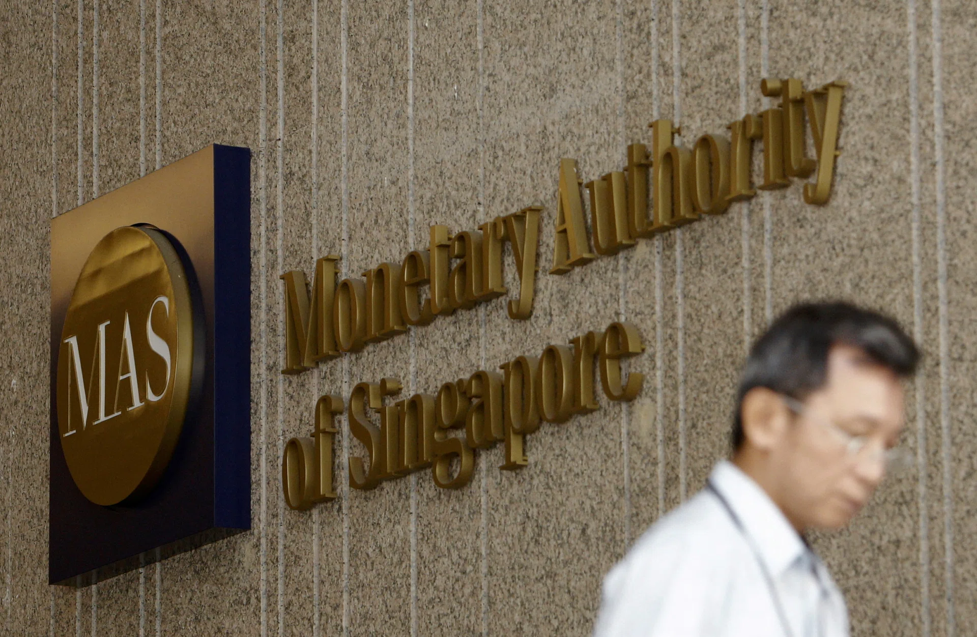 One-third of Singapore-listed firms at risk in severe AI downturn: MAS
