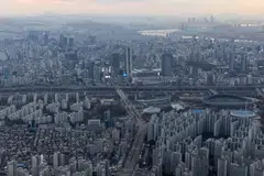 Commercial and residential buildings in Seoul, South Korea. The country's policymakers can ill afford a steep drop in property prices that might exacerbate bad loans and hurt the economy, as happened in Japan in the 1990s.