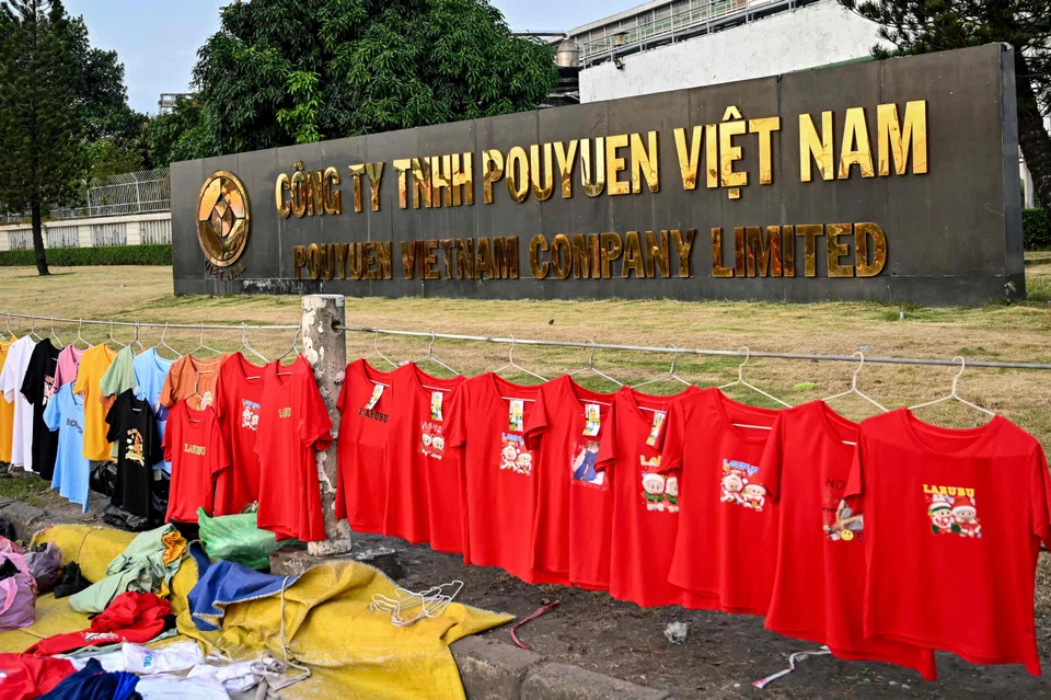T-shirts for sale at a street market outside the Pouyuen Vietnam factory, owned by Taiwanese shoemaker Pou Chen, in Ho Chi Minh City, Vietnam, Dec 23, 2024.