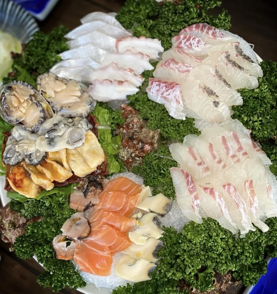 Platter of superfresh sashimi at specialty restaurants like Donghae Mirak.
