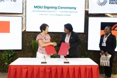 Singapore Sustainability and the Environment Minister Grace Fu (left) and Malawi Natural Resources, Energy and Mining Minister Jean Mathanga at the MOU signing in Belem, Brazil.
