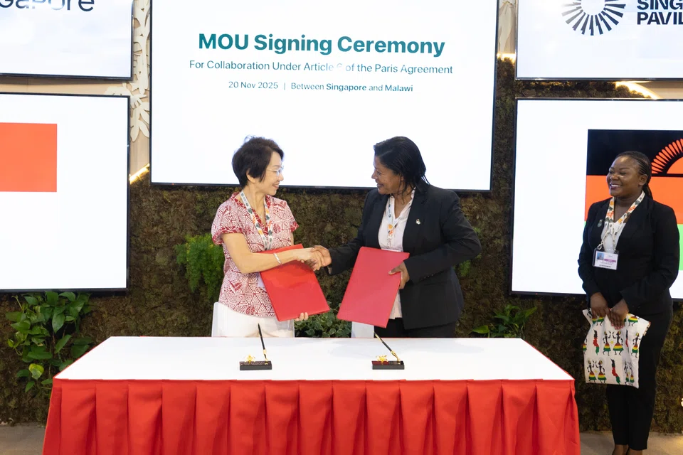 Singapore Sustainability and the Environment Minister Grace Fu (left) and Malawi Natural Resources, Energy and Mining Minister Jean Mathanga at the MOU signing in Belem, Brazil.