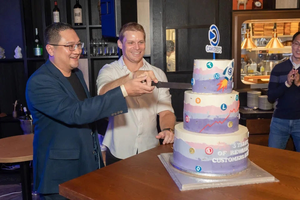 Happier times for Cake Group co-founders Chua U-Zyn (left) and current CEO Julian Hosp.
