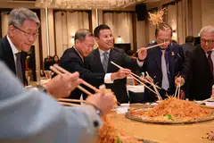 National Development Minister Desmond Lee ( centre) with Redas president Tan Swee Yiow (second from left) at Redas' annual Spring Festival lunch. This was the minister's first attendance at the event in over five years.