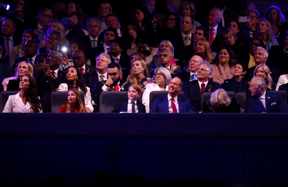 Guests at the Queen Elizabeth's Platinum Jubilee concert in front of Buckingham Palace, among them are Britain's Prince Charles, Camilla, Duchess of Cornwall, Britain's Prince William, Britain's Catherine, Duchess of Cambridge, Britain's Princess Charlotte and Prince George, British Prime Minister Boris Johnson and his wife Carrie Johnson.