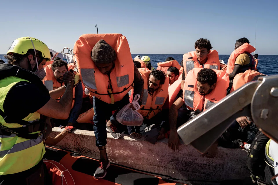 Migrants board a ship off Libya in the Mediterranean Sea after being rescued by a European maritime humanitarian organisation. A new report by the non-governmental organisation hotline Alarm Phone has noted an increase in crossings and distress alerts through the Mediterranean in 2022.