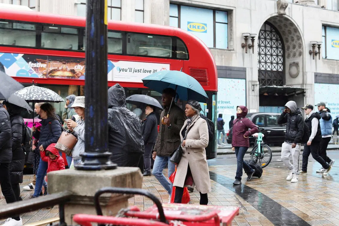 FILE PHOTO: People walk on Oxford Street in London, Britain April 10, 2023. REUTERS/Anna Gordon/File Photo
