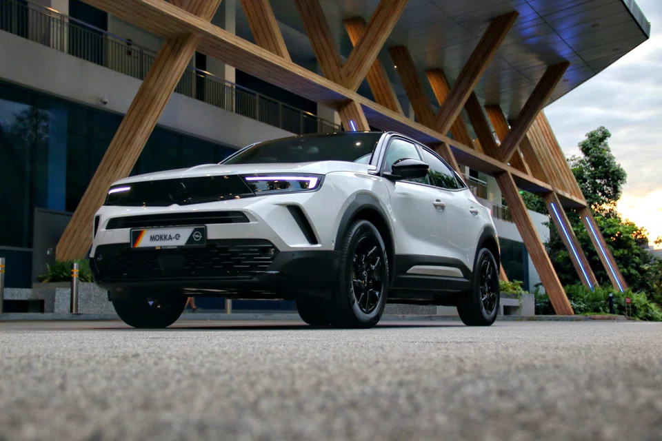 The car sports a glossy black strip that stretches across the front, like a pair of sunglasses.