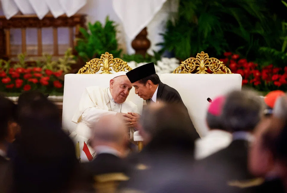 Pope Francis (L) and Indonesia's President Joko Widodo at a meeting with Indonesian authorities, civil society and the diplomatic corps at the Presidential Palace in Jakarta on Sep 4, 2024, during his apostolic visit to Asia. 