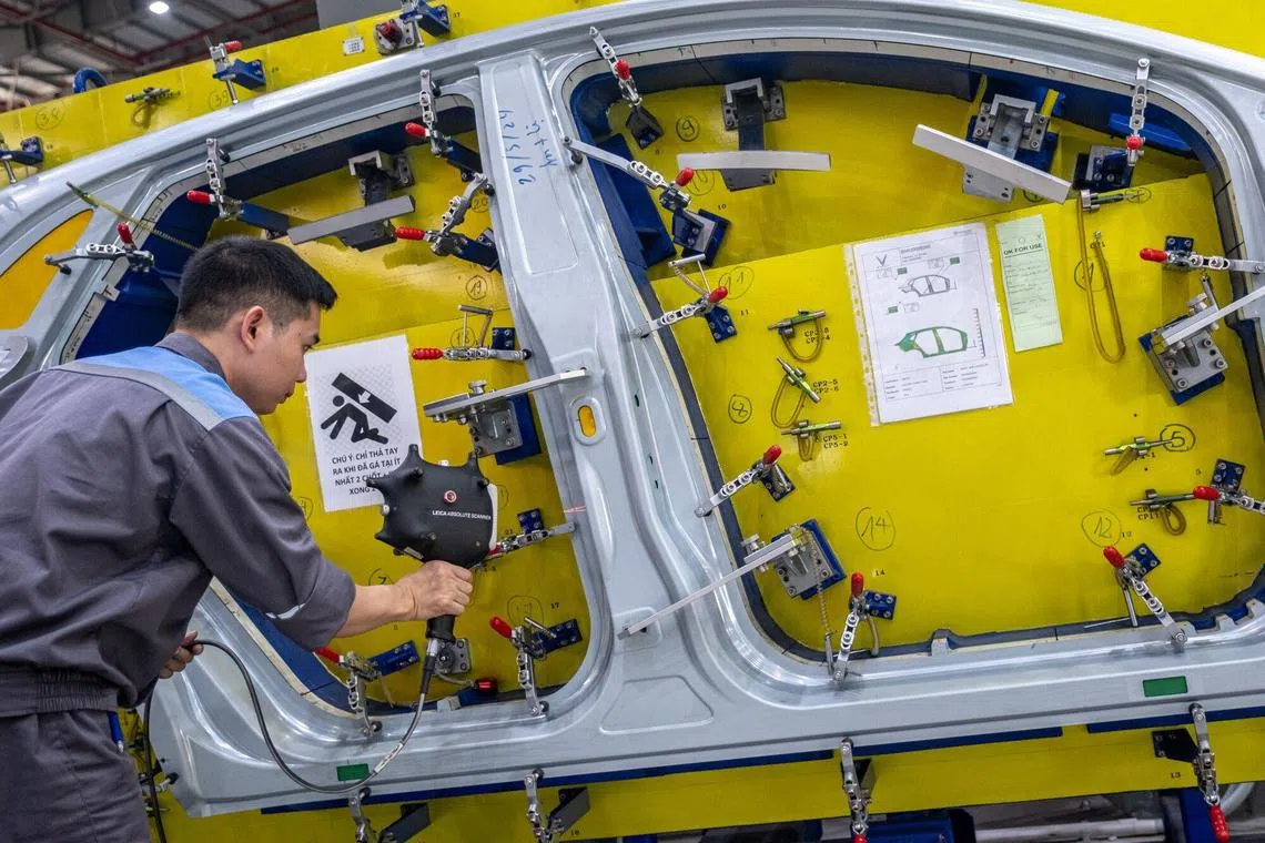 An electric vehicle manufacturing plant in Hai Phong, Vietnam. A new report forecasts that, among the top six economies in South-east Asia, Vietnam will have the highest GDP growth rate over the next decade.