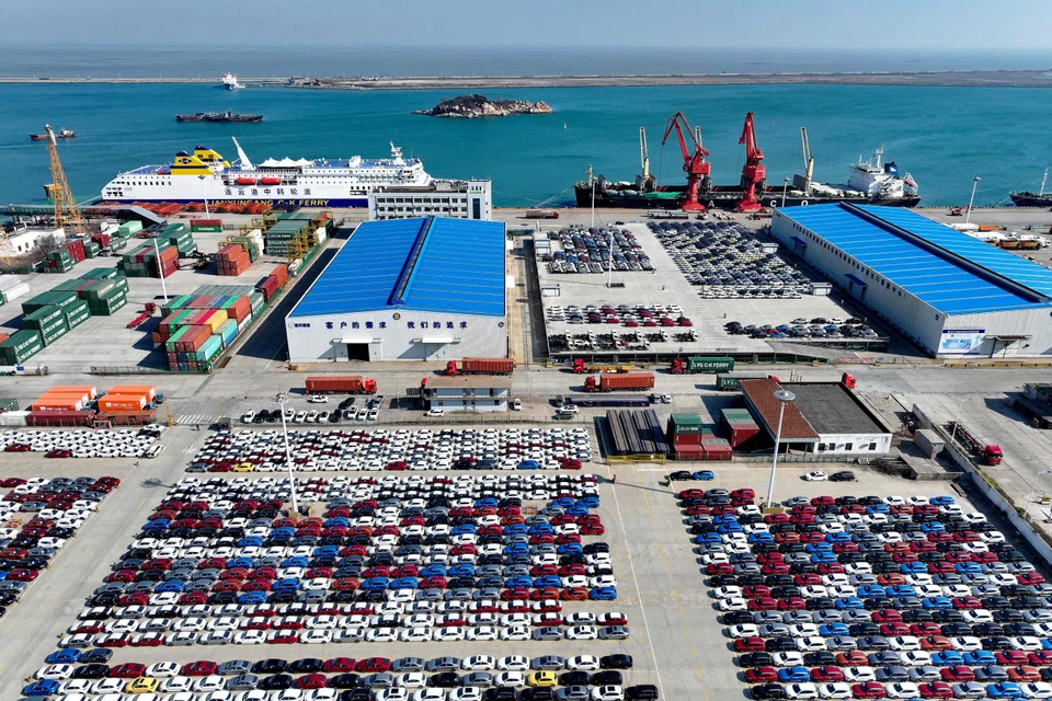 Cars waiting to be loaded onto a ship for export in Lianyungang. China has the fiscal capacity to cushion the blow from tariffs and is pivoting towards domestic demand as a primary growth driver.