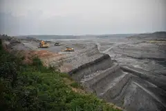 A large active mining pit in Kalimantan, Indonesia. President Prabowo Subianto has pledged to crack down on the illegal exploitation of natural resources, calling for greater involvement of the military and police in enforcement efforts.
