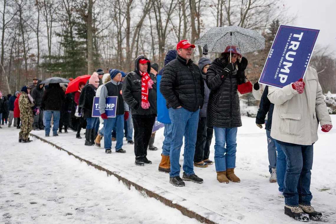 Supporters waiting for presidential candidate Donald Trump's rally in New Hampshire. Trump's victory in this week's Iowa caucuses has cemented his front-runner status among the other Republican candidates.