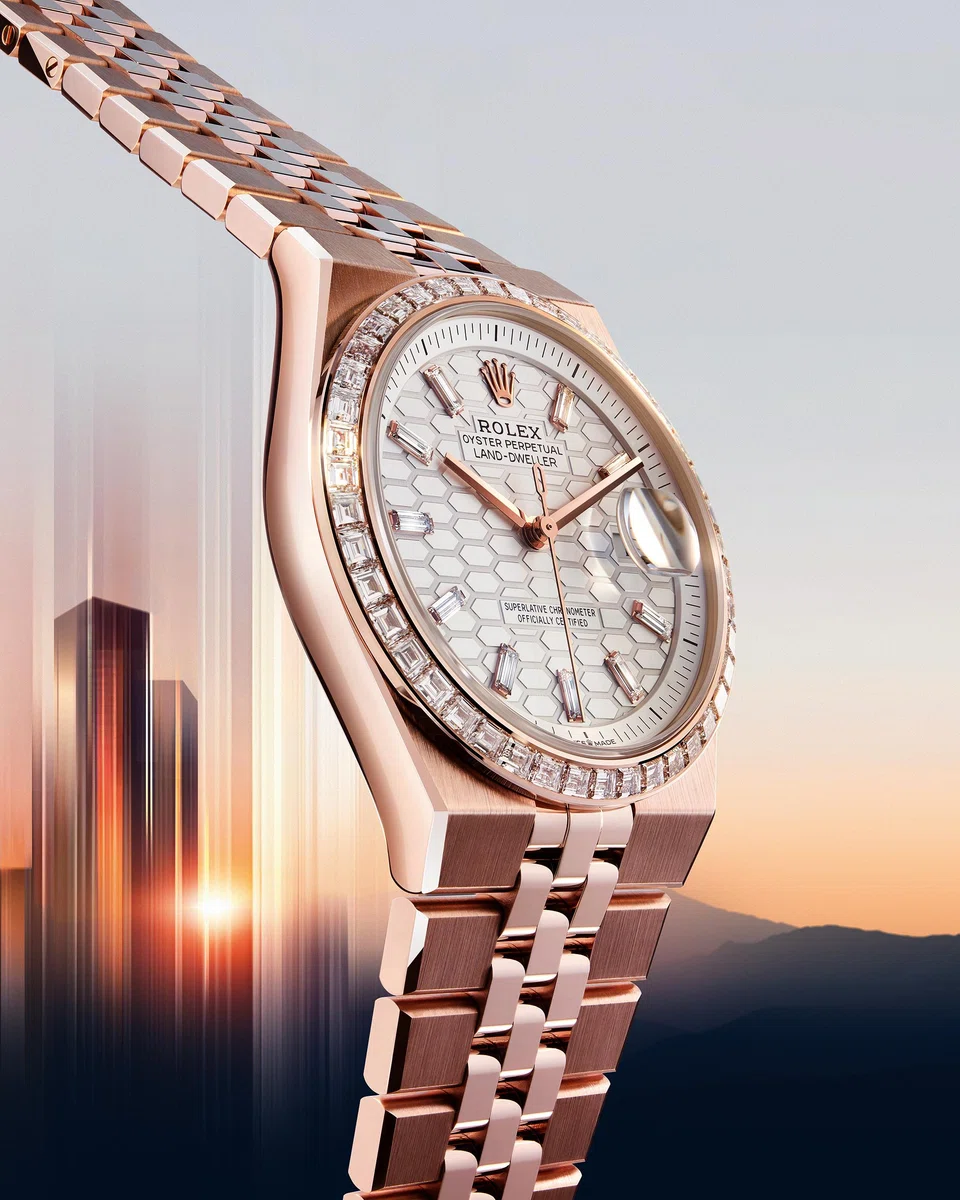 The Land-Dweller 36 in full Everose gold flaunts an intense white dial in satin finish, with diamond hour markers and diamonds set on its bezel.