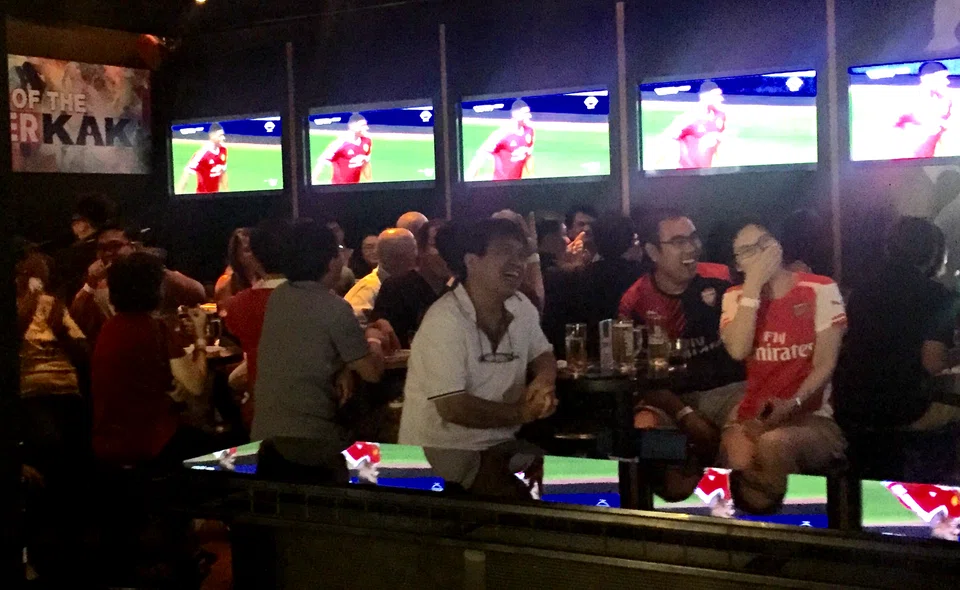 Football fans enjoying an EPL live screening event in Clarke Quay in 2016.  StarHub has confirmed that every single game will be screened “live” in HD quality across the company’s TV, mobile and broadband platforms.