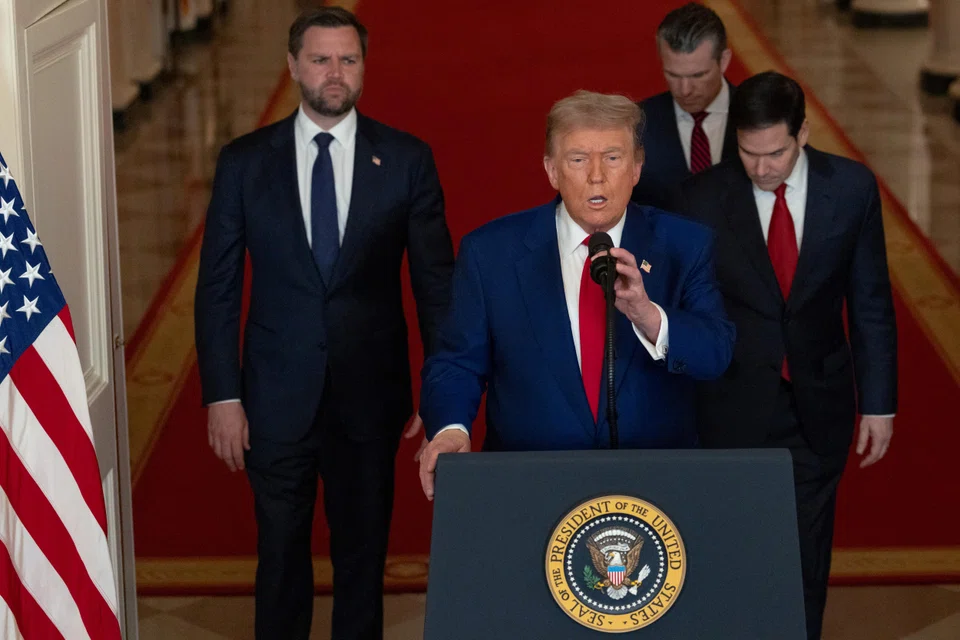 US President Donald Trump delivers an address to the nation alongside (from left) Vice President JD Vance), Secretary of State Marco Rubio and Defense Secretary Pete Hegseth.
