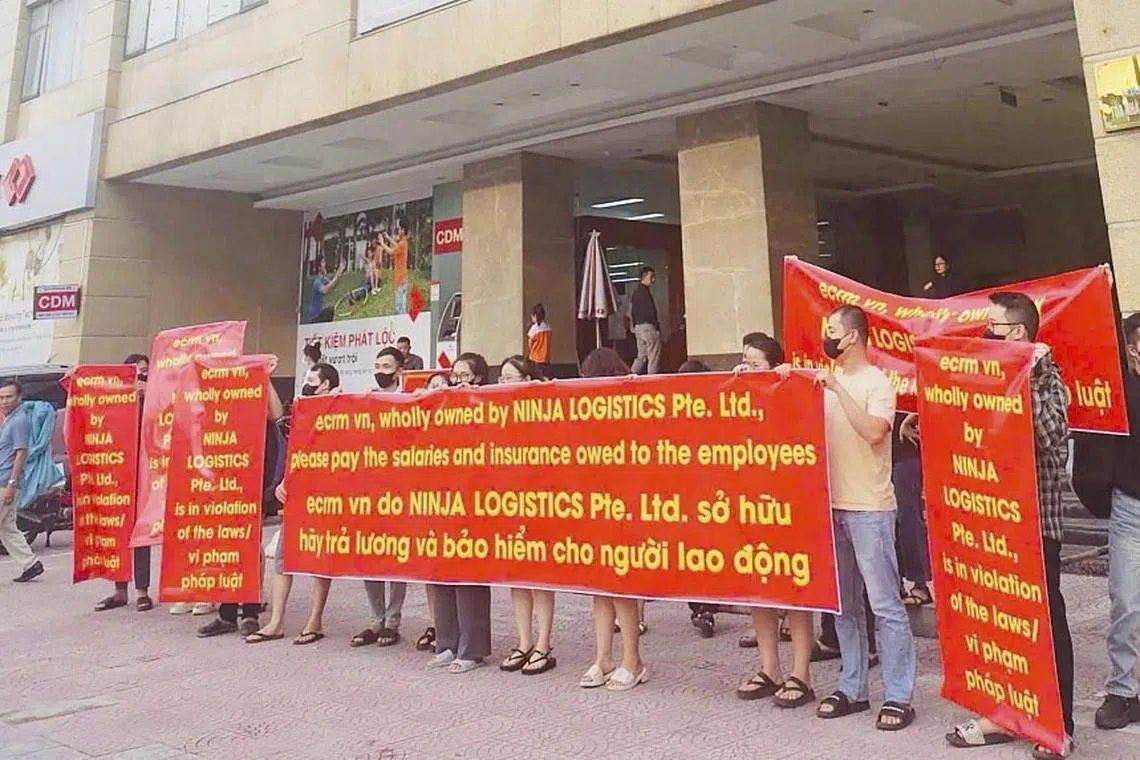 Workers at ECRM Nobita protesting outside a company office on Sep 12, saying they were owed wages and social insurance contributions. 