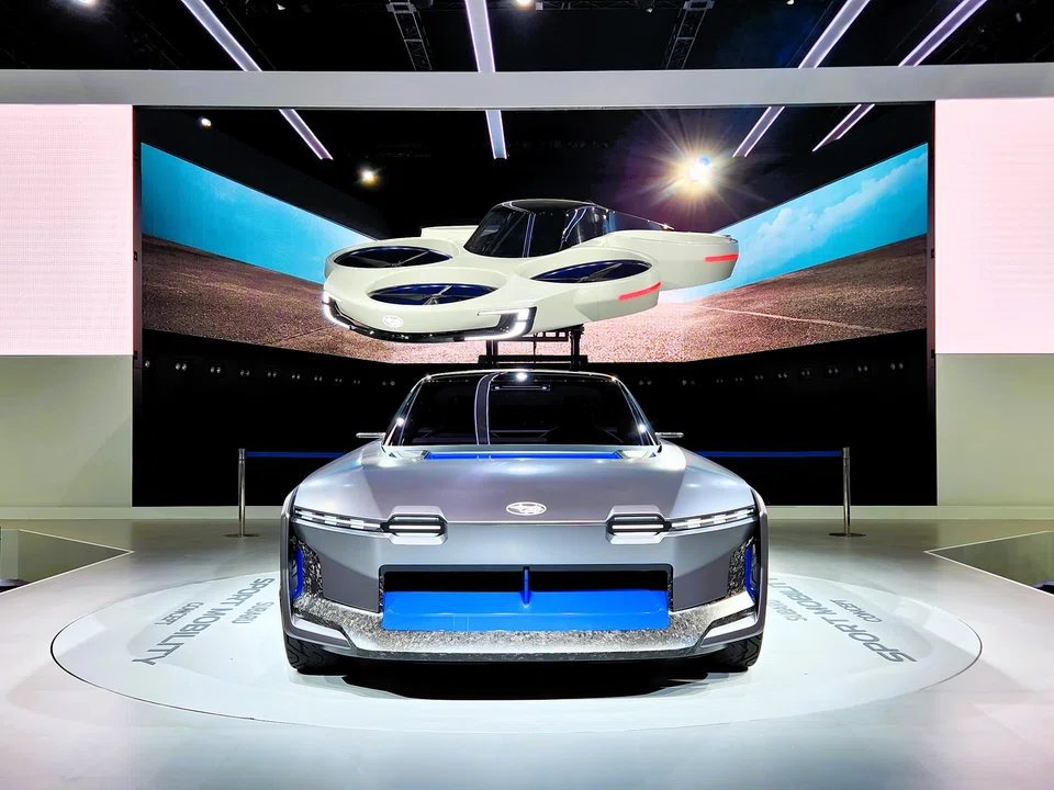 Subaru shows a concept electric vertical take-off and landing aircraft along with a concept electric sports car at the Japan Mobility Show 2023.