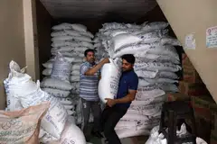 Sacks of refined sugar at a wholesale store in New Delhi, India. Adverse weather conditions continue to hinder sugar production in both Thailand and India, providing a strong undercurrent to the global sugar price surge.