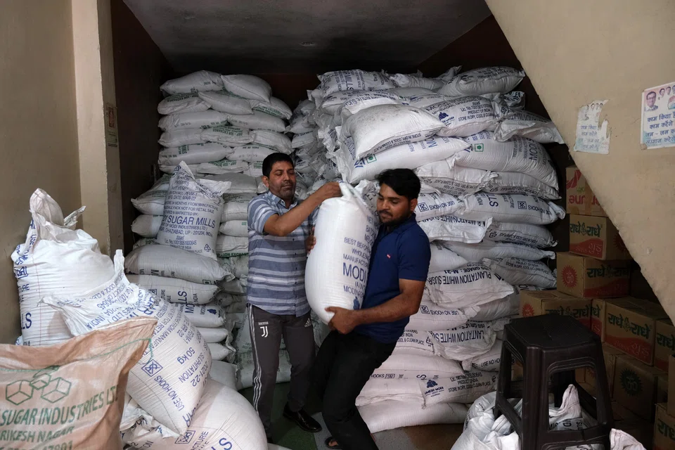 Sacks of refined sugar at a wholesale store in New Delhi, India. Adverse weather conditions continue to hinder sugar production in both Thailand and India, providing a strong undercurrent to the global sugar price surge.