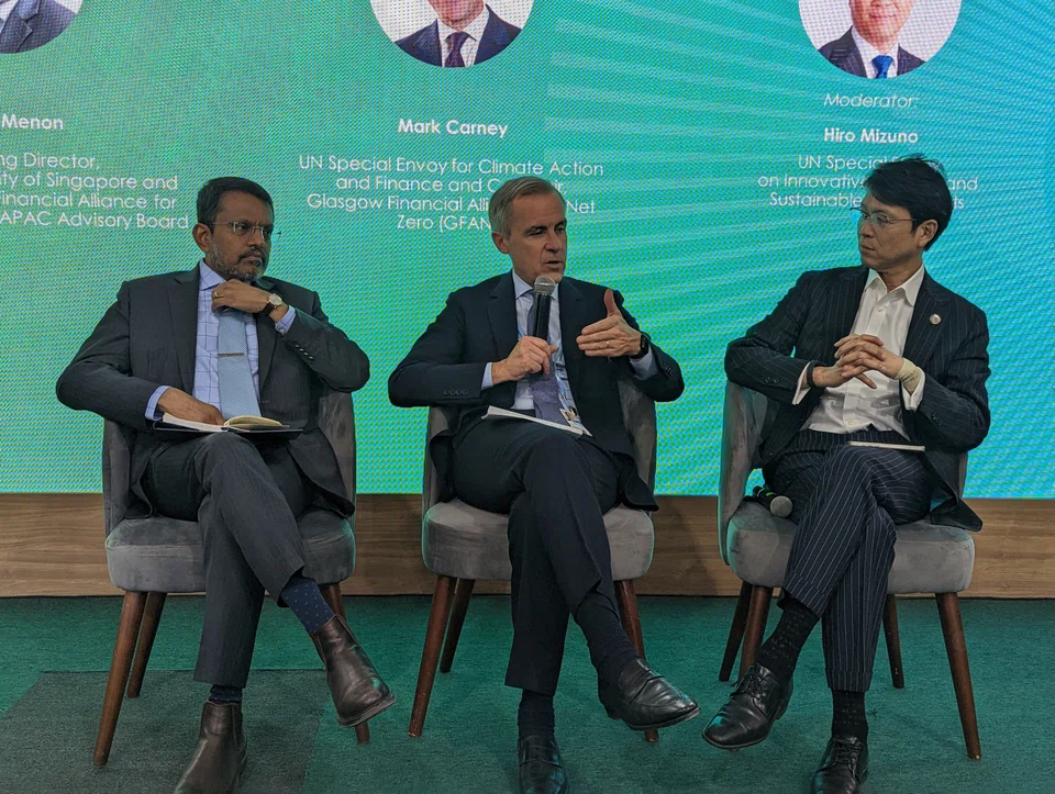 From left: Ravi Menon, managing director of the Monetary Authority of Singapore, Mark Carney, co-chair of the Glasgow Financial Alliance for Net Zero, and Hiro Mizuno, UN Special Envoy on Innovative Finance and Sustainable Investments. 