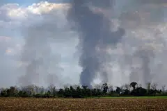 Pillars of smoke rise over a field in the Kharkiv region, Ukraine, May 20, 2024. The ratcheting-up of conflict – from Russia’s war in Ukraine to trade restrictions – has loomed over global investors for several years, but with the inflation tide ebbing, and as nearly half the world’s population votes on new leaders, the tensions are now centre stage.