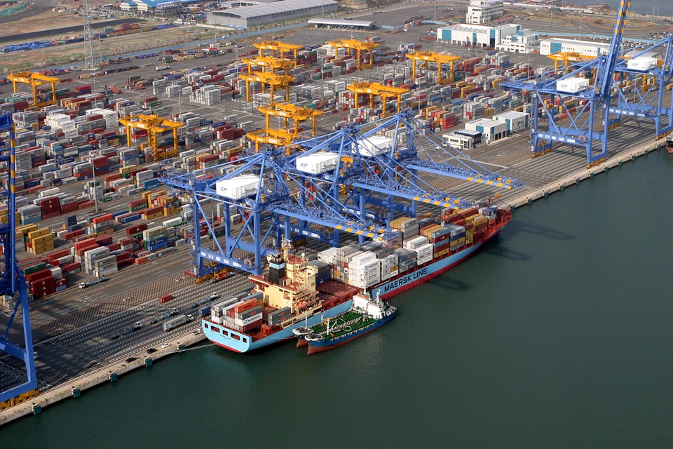 An aerial view of port and cranes at Pusan Newport Company. DP World specialises in cargo logistics, port terminal operations, maritime services and free trade zones. 