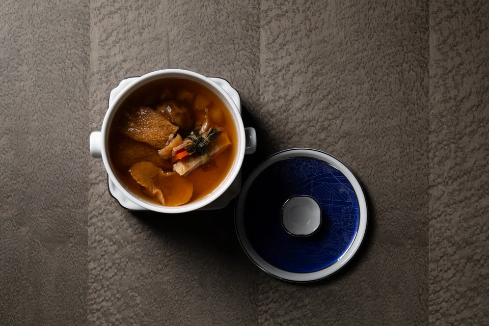 Double-boiled duck leg soup with herbs.