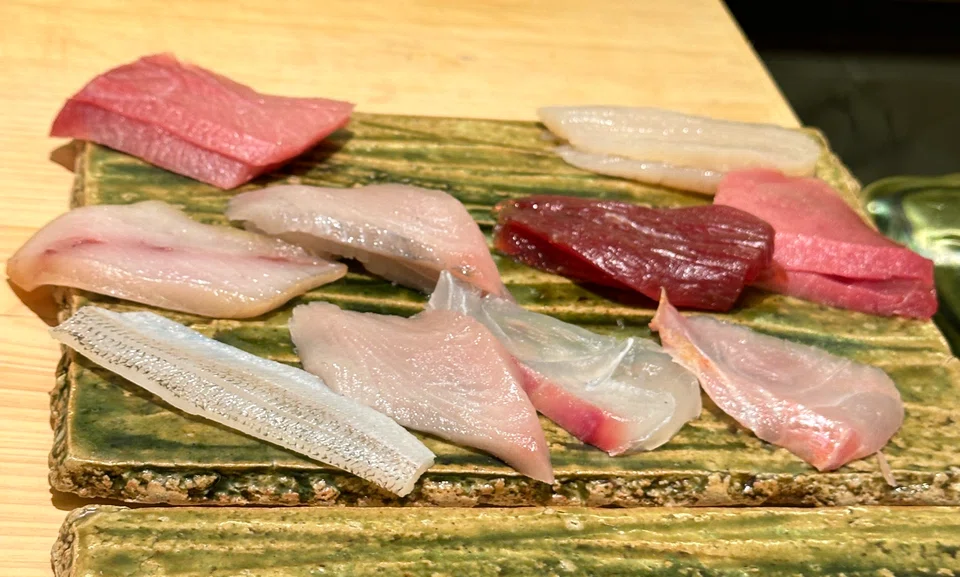An extensive variety of fish waiting to be turned into sushi.