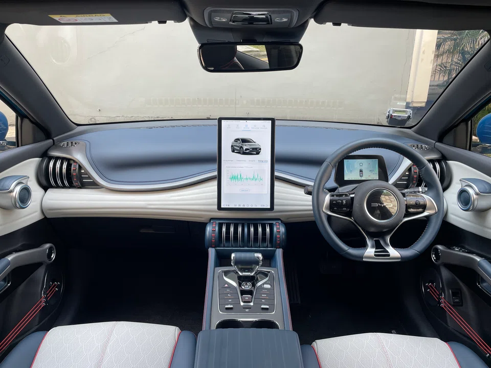 Inside the car, what really draws the oohs and aahs is the 12.8-inch (32.5 cm) infotainment screen that rotates between portrait and landscape positions at the touch of a button.