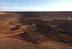 FILE PHOTO: An autonomous truck readies to pick up a load of iron ore at Australia's Fortescue Metals Group (FMG) Chichester Hub, which includes the Christmas Creek iron ore mine, in the Pilbara region, located southeast of the coastal town of Port Hedland in Western Australia, November 29, 2018. Picture taken November 29, 2018.  REUTERS/Melanie Burton/File Photo