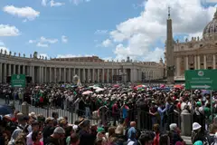 Throughout the day, vast crowds of people had packed the wide avenue leading to the basilica, pilgrims and tourists mingling with Italians enjoying a public holiday.