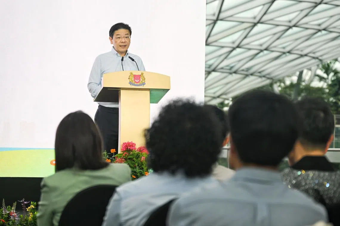 Prime Minister Lawrence Wong speaking at the REACH 40th Anniversary Launch Ceremony at Jewel Changi Airport.
