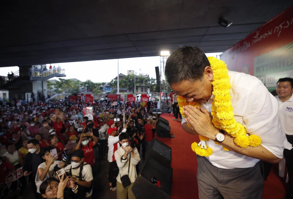 Thai property tycoon-turned-politician and one of the three Pheu Thai Party's prime ministerial candidate Srettha Thavisin greets supporters during an election campaign in Bangkok.