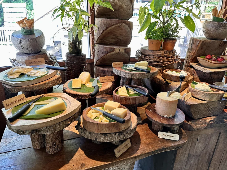 A cheese room features all manner of cheeses to pick from.