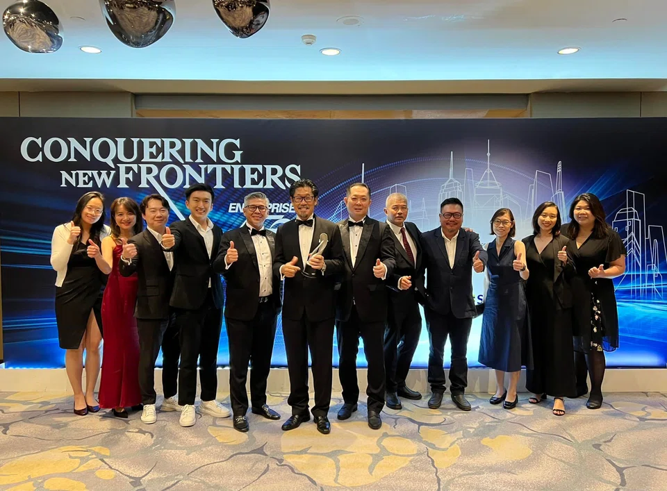 Management and staff of JGL Worldwide at the Enterprise 50 awards ceremony in 2023. Among them are chief executive officer Daniel Lim, chairman Desmond Gay and chief operating officer David Hia (fifth to seventh from left).