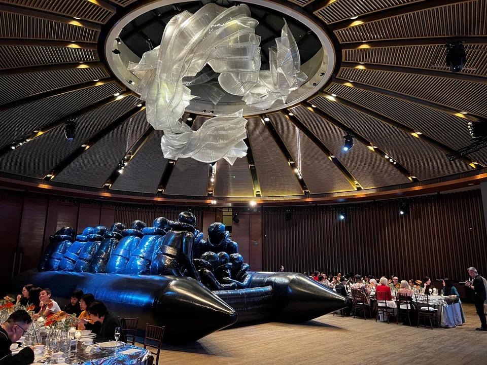Ai Weiwei’s raft of refugees placed between diners at Capella Singapore.