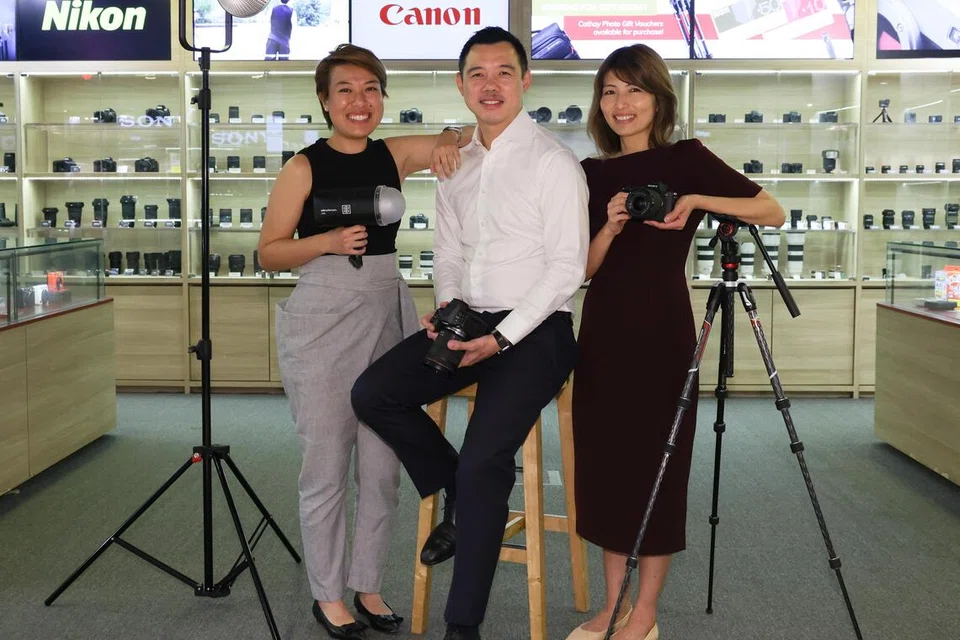 (From right to left) Jill Koh, Ryan Toh and Charmaine Toh are the third-generation owners of 66-year-old Cathay Photo. 
