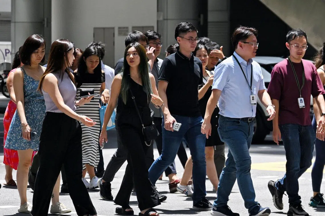 Office workers at Robinson Road, 29 April 2024. Can use for stories on finance, business, trusted securities, insight, global market, manpower, employment